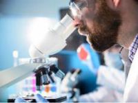 Male-scientist-looking-through-microscope-promo-thumb.jpg