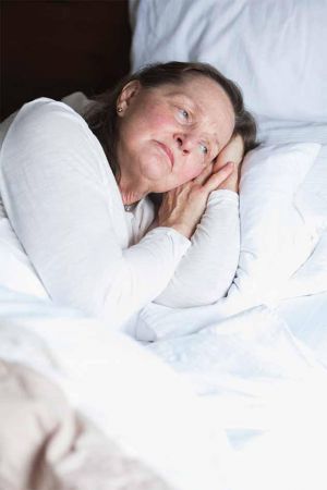 Caucasian-woman-bed-depressed-article.jpg