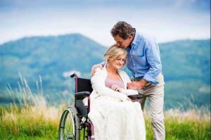 Husband-embracing-wife-in-wheelchair-article.jpg